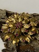 Brooch with Red Rubies, 18 carats.Diameter: 3.8 cm.