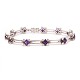 Leddelt armbånd i 18kt hvidguld med kasselås og dobbelt sikkerhedslås prydet med 11 ametyster flankeret af hver 4 diamanter på ca. 0,03ct. I alt ca. 1,32ct. L: 18,5cm