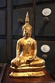 Old oriental buda in gilded iron. H: 22.5cm.