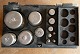 Weights in clear steel and in a box, all stamped. A total of 12 weights from 500 gram down to 1 gram.