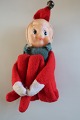 Gammel nisse, med armene omkring de foldede ben, som kan foldes udOprindelig klokke i huenH: ca. 12,5cmFra 1960-erne