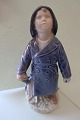 Royal Copenhagen (RC) figurDreng med paraply (samt skoletaske og sydvest)Design: Ada BonfilsNr.: 35561. SorteringH: 18cm