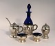 Danish work. Silver (830). 2 salt jars with spoons, pepper shaker, mustard jar and vinegar bottle. 7 parts. Produced 1918.