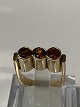 14 karat gold, Ladies ring with 3 Orange stones.Ring size 52.