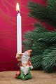 Lille biskuit nisse med fin patina som holder et lille julelys...