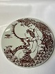 Brown round plate from Bjørn Wiinblad, AftenDimensions: Ø: 18 cm.