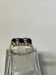 14 carat Gold Ladies Ring with blue sapphire and clear stone.Size 57.