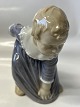 Bing & Grondahl figurine, girl bending down.Decoration No. 1995.