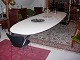 Piet hein bord Super elipse med hvid laminat.Længde 420 *140 med 10 stål ben i meget fin stand .5000 m2 udstilling