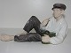 Royal Copenhagen FigurineFarmboy laying with his green lunch box