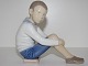Bing & Grondahl FigurineBoy sitting on a book
