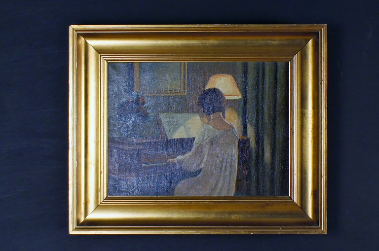 Aage Jessen, born near Viborg 1876, died 1961.Interior with woman reading. Signed Aage Jessen. Oil on canvas.