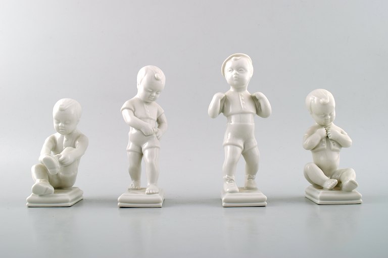Edit Bjurström (1912-1998) for Rörstrand, Sweden.4 boy figures in blanc de chine/white porcelain.