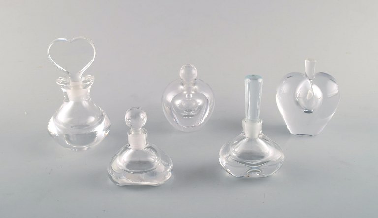 Edward Hald for Orrefors, Sweden. A collection of five mouth blown flacons in clear art glass. Designed in the 1940