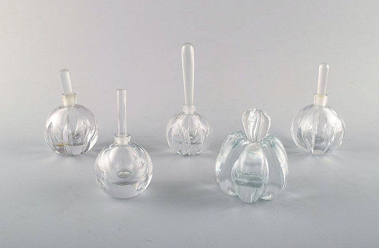 Edward Hald for Orrefors. A collection of five mouth blown flacons in clear art glass. Designed in the 1940