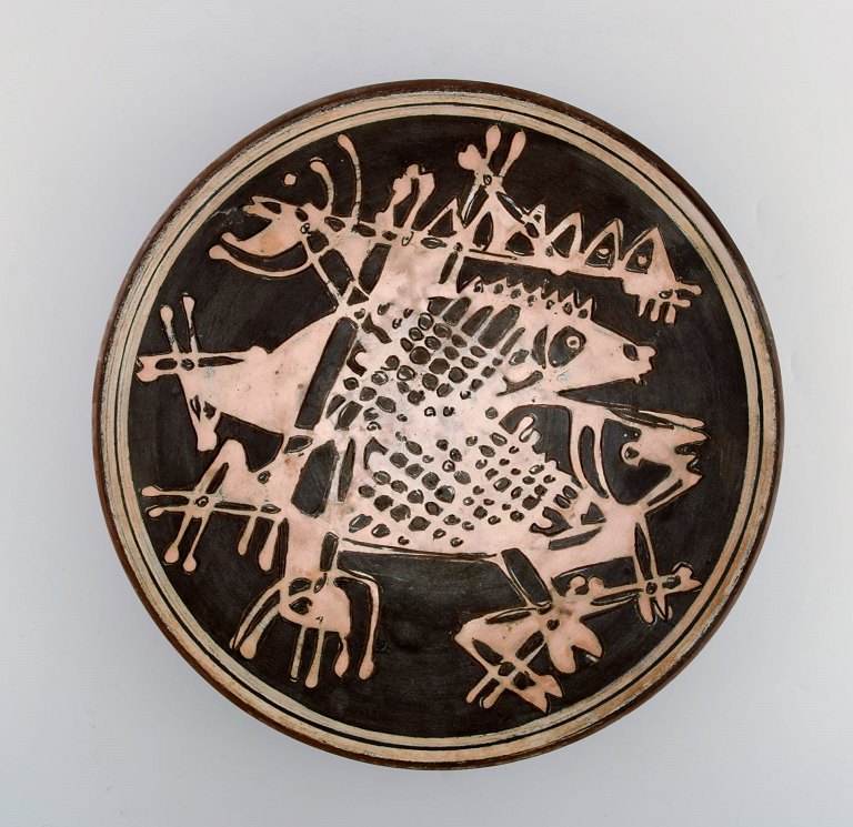 Ivy Lysdal, b. 1937. Danish ceramist and painter.Unique bowl in glazed ceramics with fish motif. 1970