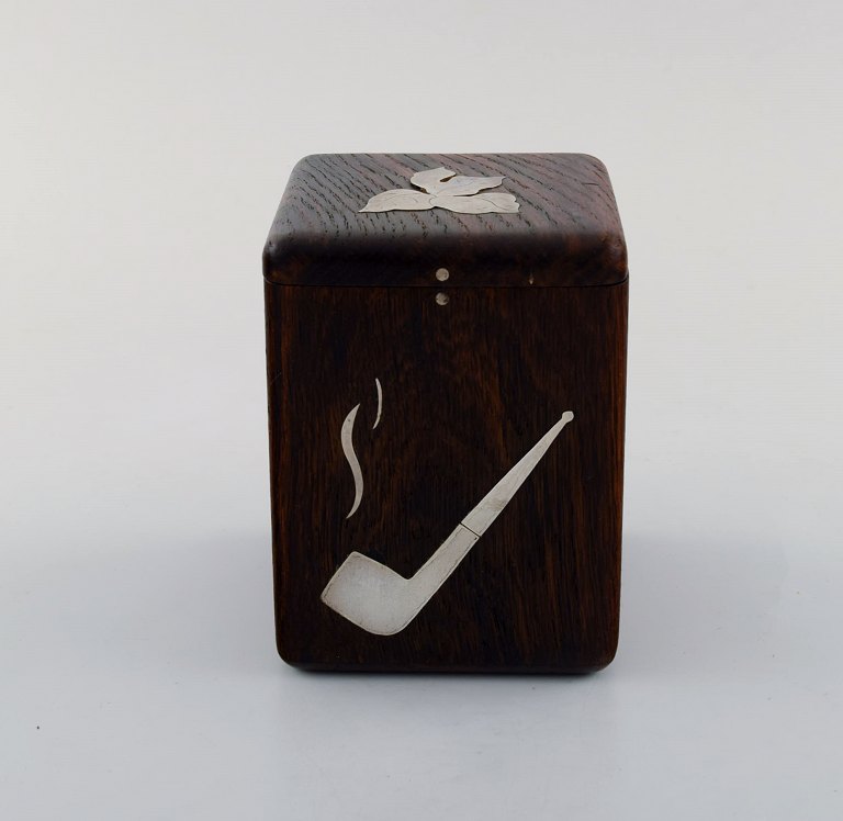 Svend Weihrauch for Franz Hingelberg, Denmark. Rosewood tobacco jar with silver inlay in the form of pipe and tobacco leaf.