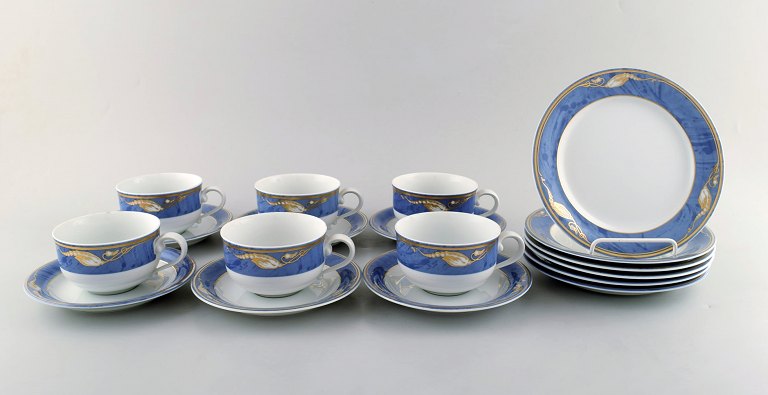 Royal Copenhagen. Set of six "Magnolia" tea cups with saucers and six plates. Late 20th century.