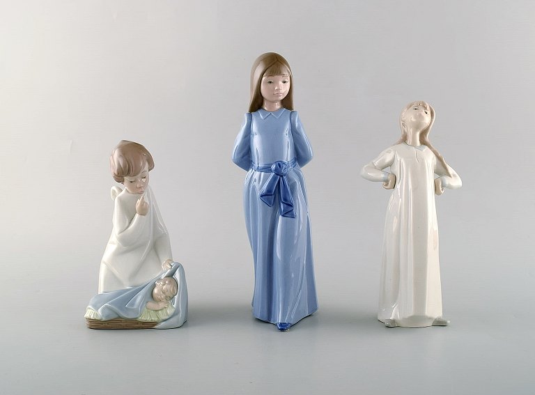 Nao and Lladro. Three porcelain figures. 20th century.