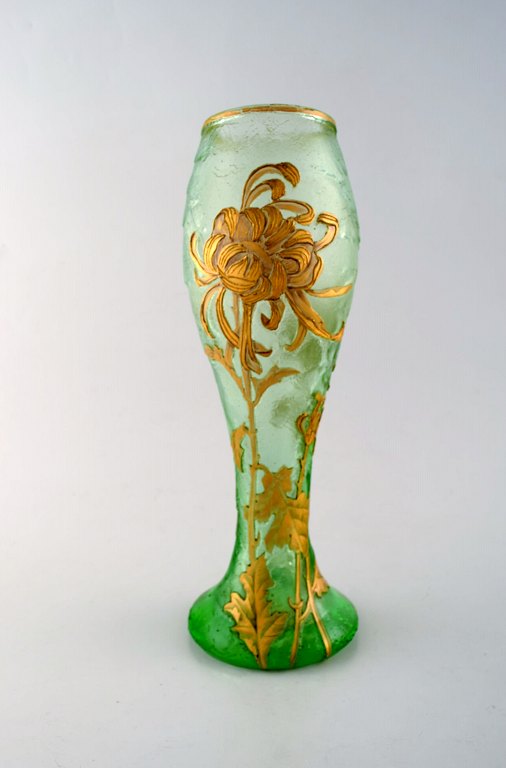 Montjoye, France. Large art nouveau vase in mouth-blown art glass. Decorated with flowers in enamel work, gilt. High quality vase. Dated 1880-1900.