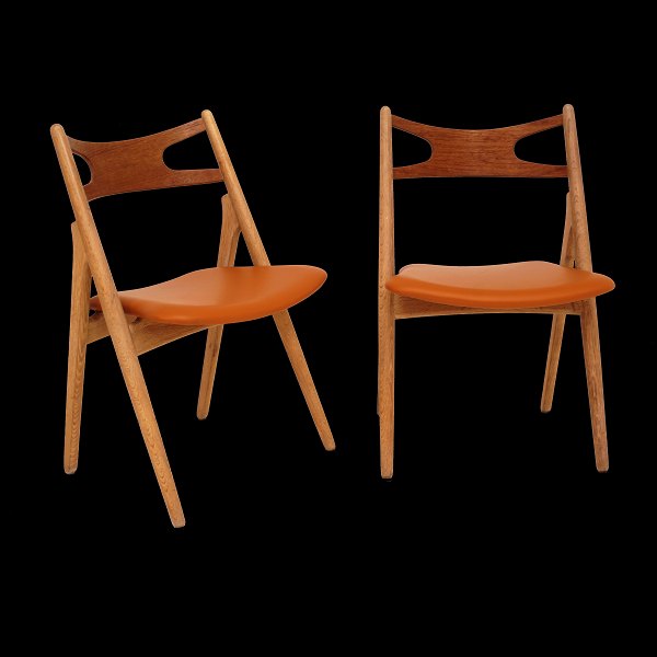 Hans J. Wegner, Denmark: Set of four "Sawhorse Chairs", CH29, by Carl Hansen & Søn, Denmark, with new upholstery