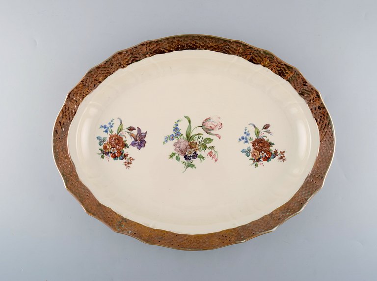 Royal Copenhagen serving dish in porcelain with floral motifs and gold border. Mid 20th century.