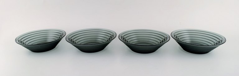 Aino Aalto for Iittala. Four bowls in blue green mouth blown art glass. Finnish design, 21 c.