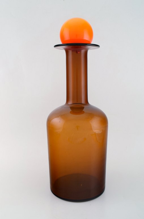 Otto Brauer for Holmegaard. Large vase / bottle in light brown art glass with orange ball. 1960