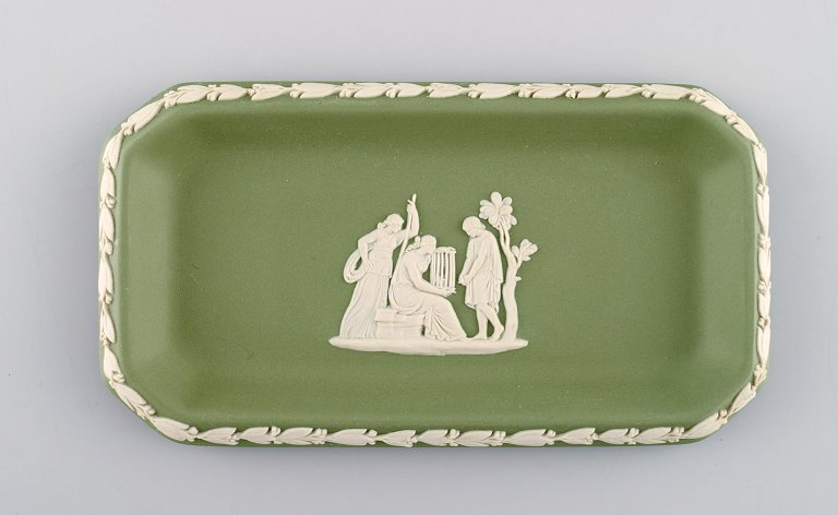 Wedgwood, England. Small square dish in green stoneware with classicist scenes in white. Approx. 1930.