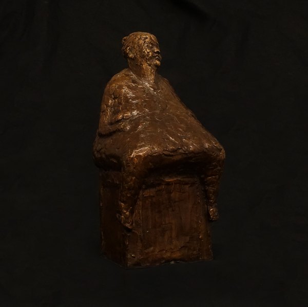 Hanne Varming, Denmark, b. 1939: A bronze sculpture, "Woman at box". Signed and dated 2000. H: 25cm. W: 12cm. D: 12cm. W: 2,7kg