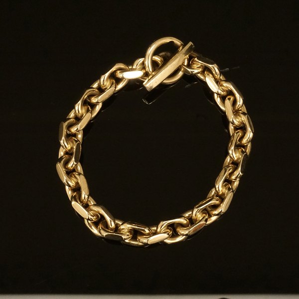 Ankerarmbånd i 14kt guld. Jannik Lilleriis Andersen, Ringsted: Særdeles kraftigt anker armbånd i 14kt guld. L: 22cm. V: 84,3gr