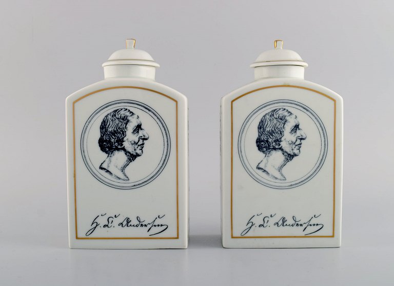 A pair of Bing & Grondahl H.C. Andersen tea caddies in porcelain with motifs from Copenhagen and Odense.