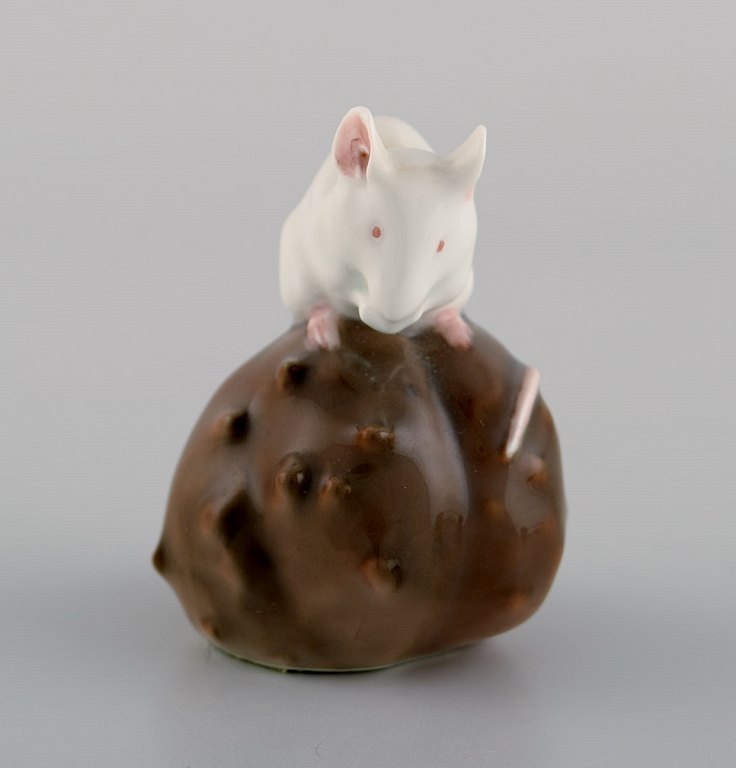 Royal Copenhagen porcelain figurine. Mouse on Chestnut. Early 20th century. Model number 511.