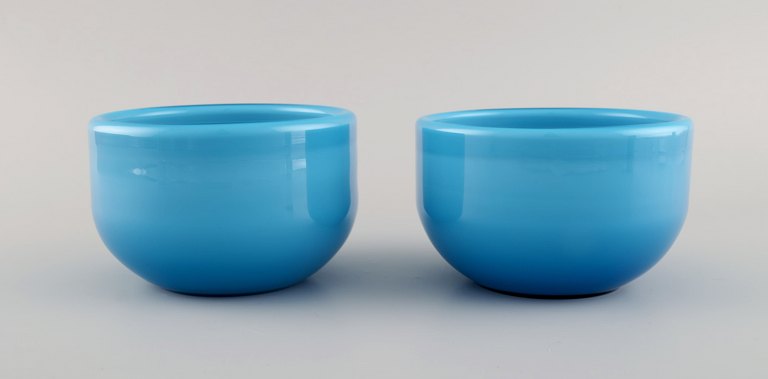 Michael Bang for Holmegaard. Two Palet bowls in light blue mouth blown art glass. Mid-20th century.