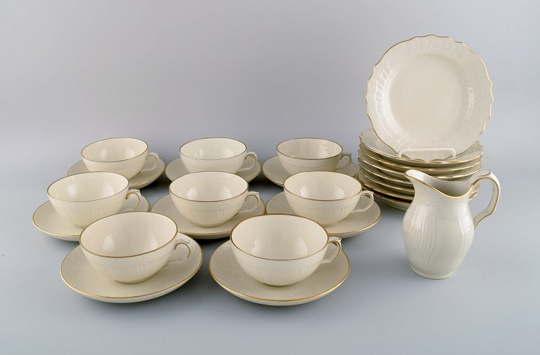 Royal Copenhagen Creme Curved tea service for eight people. Mid-20th century.