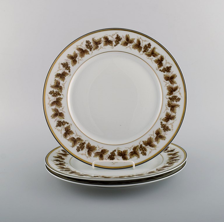 Three large Limoges porcelain plates with hand-painted grape vines and gold decoration. 1930s / 40s.