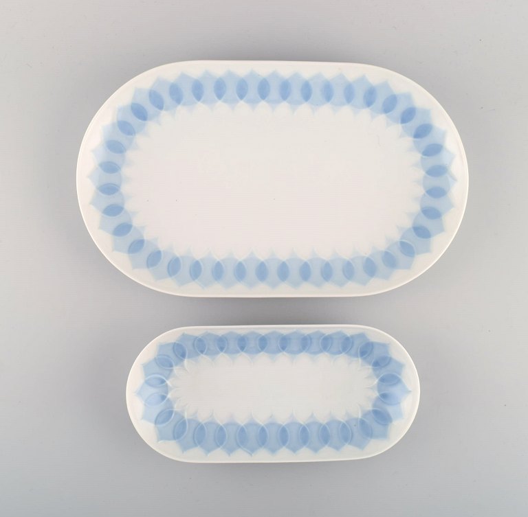 Bjørn Wiinblad for Rosenthal. Two Lotus porcelain serving dishes decorated with light blue lotus leaves. 1980s.