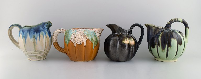 Four retro jugs in glazed ceramics. Beautiful glazes and shapes. Belgium, 1960s / 70s.