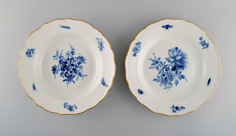 Two antique Meissen porcelain plates with hand-painted flowers and gold edge. Approx. 1900.