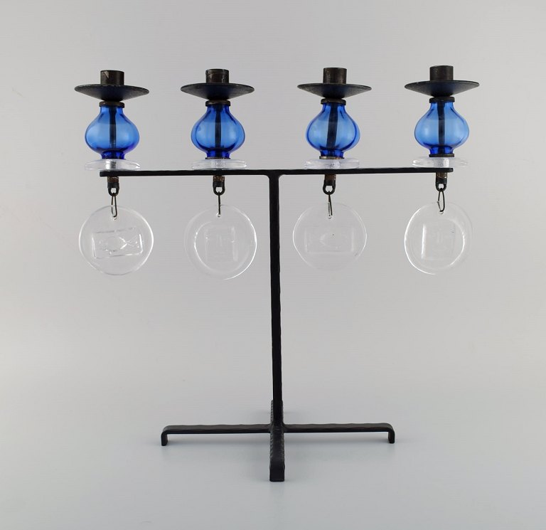 Erik Höglund for Kosta Boda, large candle holder in cast iron with mouth blown glass. Mid 20th century.
