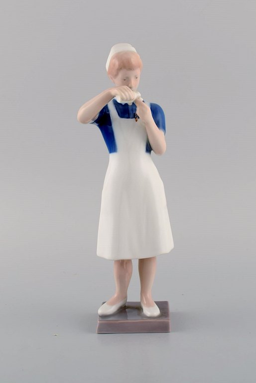 Rare Bing & Grøndahl porcelain figurine. Nurse. Model number 2379. Mid 20th century.