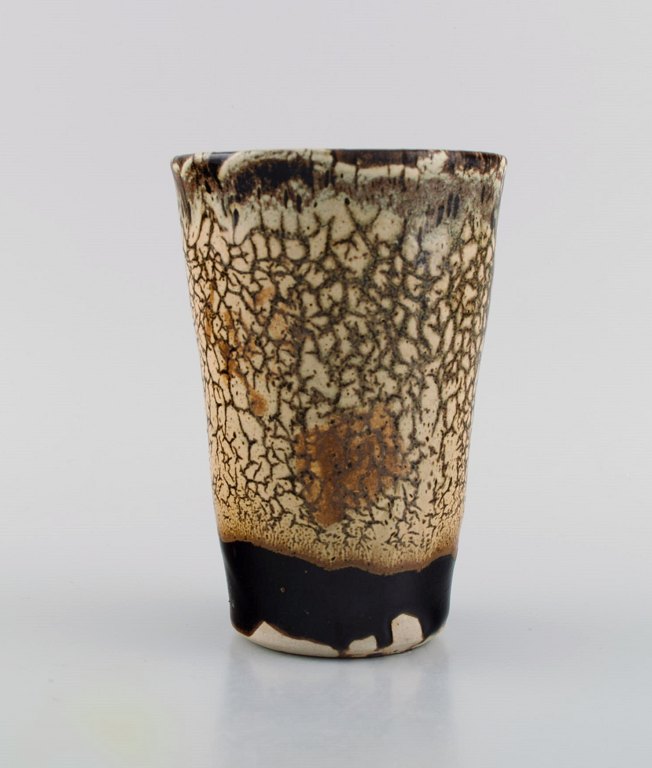 Isabelle Dacourt, France. Unique vase in glazed stoneware. Beautiful crackled glaze in cream and dark shades. Late 20th century.