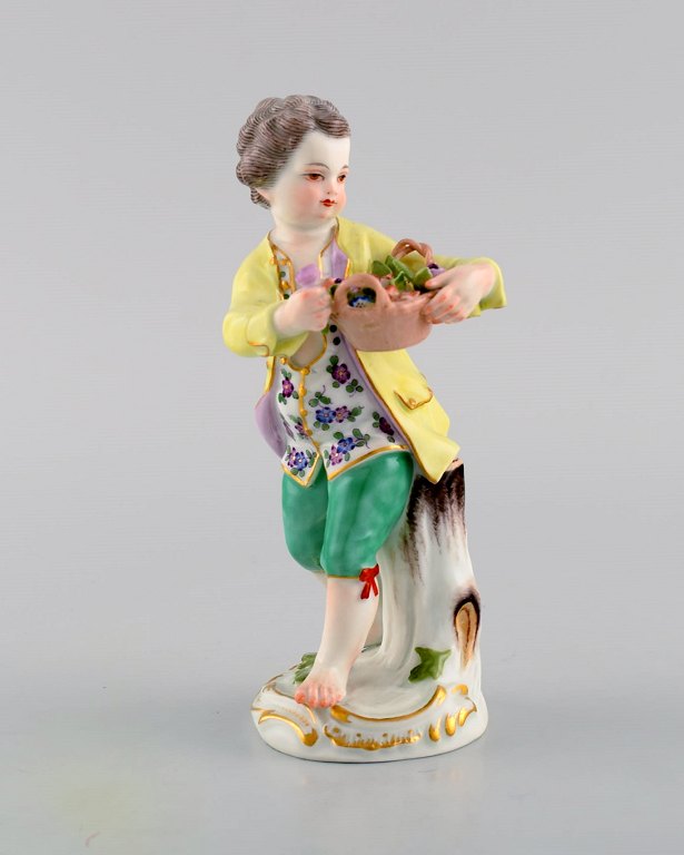 Antique Meissen porcelain figurine. Boy with flower basket. Model 149. Approx. 1900.
