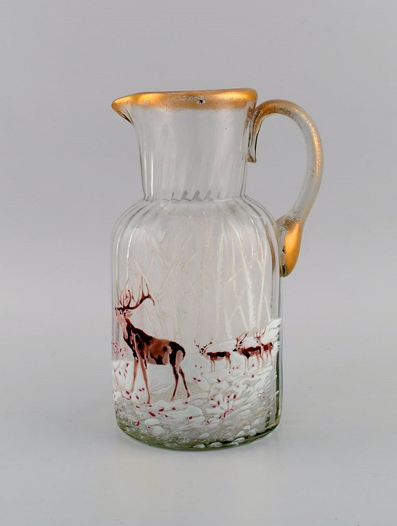 Legras Saint Denis. Russian beer jug in mouth blown art glass with hand-painted red deer in winter landscape. France, ca. 1900.