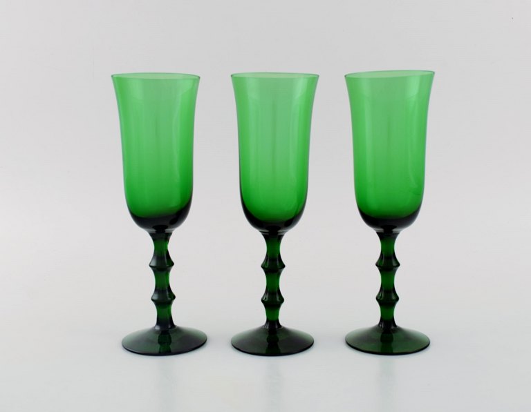 Simon Gate for Orrefors. Three Salut champagne glasses in green mouth blown art glass. Swedish design, 1920s / 30s.