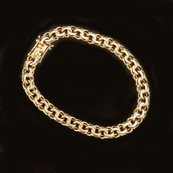 14kt gold bracelet by Bremer Jensen, Randers, Denmark. L: 19,5cm. W: 7mm. W: 20gr