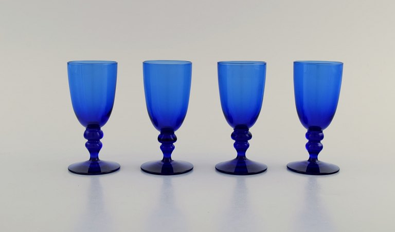 Monica Bratt for Reijmyre. Four shot glasses in blue mouth blown art glass. Swedish design, mid 20th century.