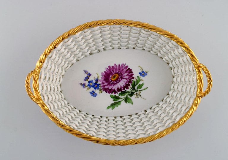 Antique Meissen braided porcelain basket with handles. Hand-painted flowers and golden border. Late 19th century.