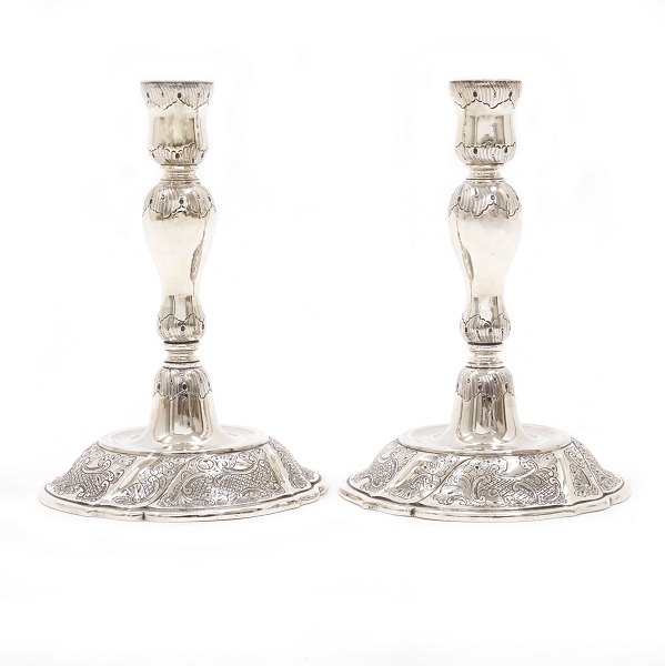 Pair of sterlingsilver candlesticks by Axel Salomonsen, Copenhagen. H: 18,8cm. W: 748gr