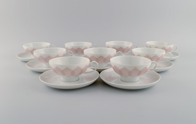 Bjørn Wiinblad for Rosenthal. Lotus porcelain service. 9 teacups with saucers decorated with pink lotus leaves. 1980s.
